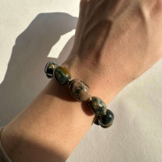 Bracelet made of natural jasper with a silver clasp in gilding