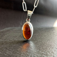 Amber pendant in silver on a chain