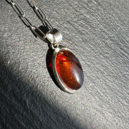 Amber pendant in silver on a chain