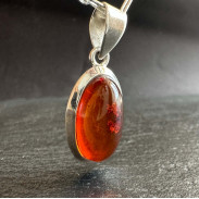 Amber pendant in silver on a chain