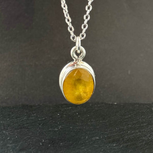 Pendant with natural yellow sapphire made of silver on a chain