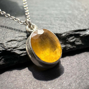 Pendant with natural yellow sapphire made of silver on a chain