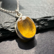 Pendant with natural yellow sapphire made of silver on a chain