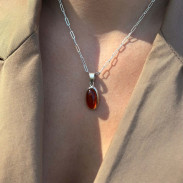 Amber pendant in silver on a chain