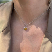 Pendant with natural yellow sapphire made of silver on a chain