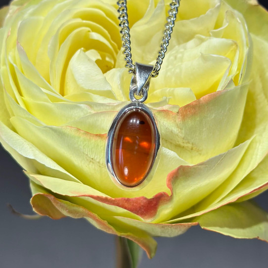 Amber pendant in silver on a chain