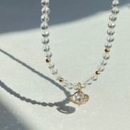 Pendant Planet on a choker made of Natural Rock Crystal
